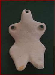 Hamangia culture. Headless stauette. Very stylised. It was probably worn as part of a necklace.